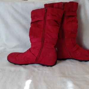 Red winter boots with buckles on the side